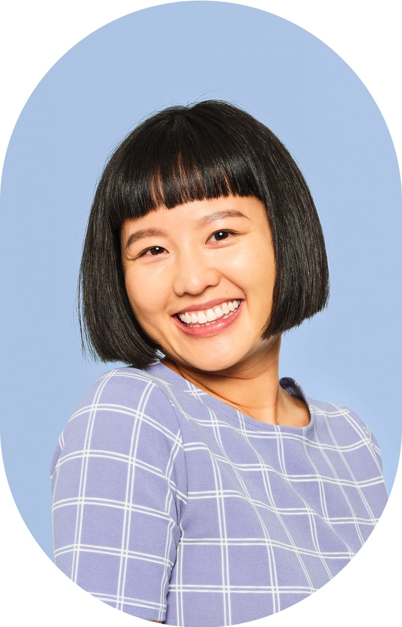 A woman with a short bob hairstyle is smiling.