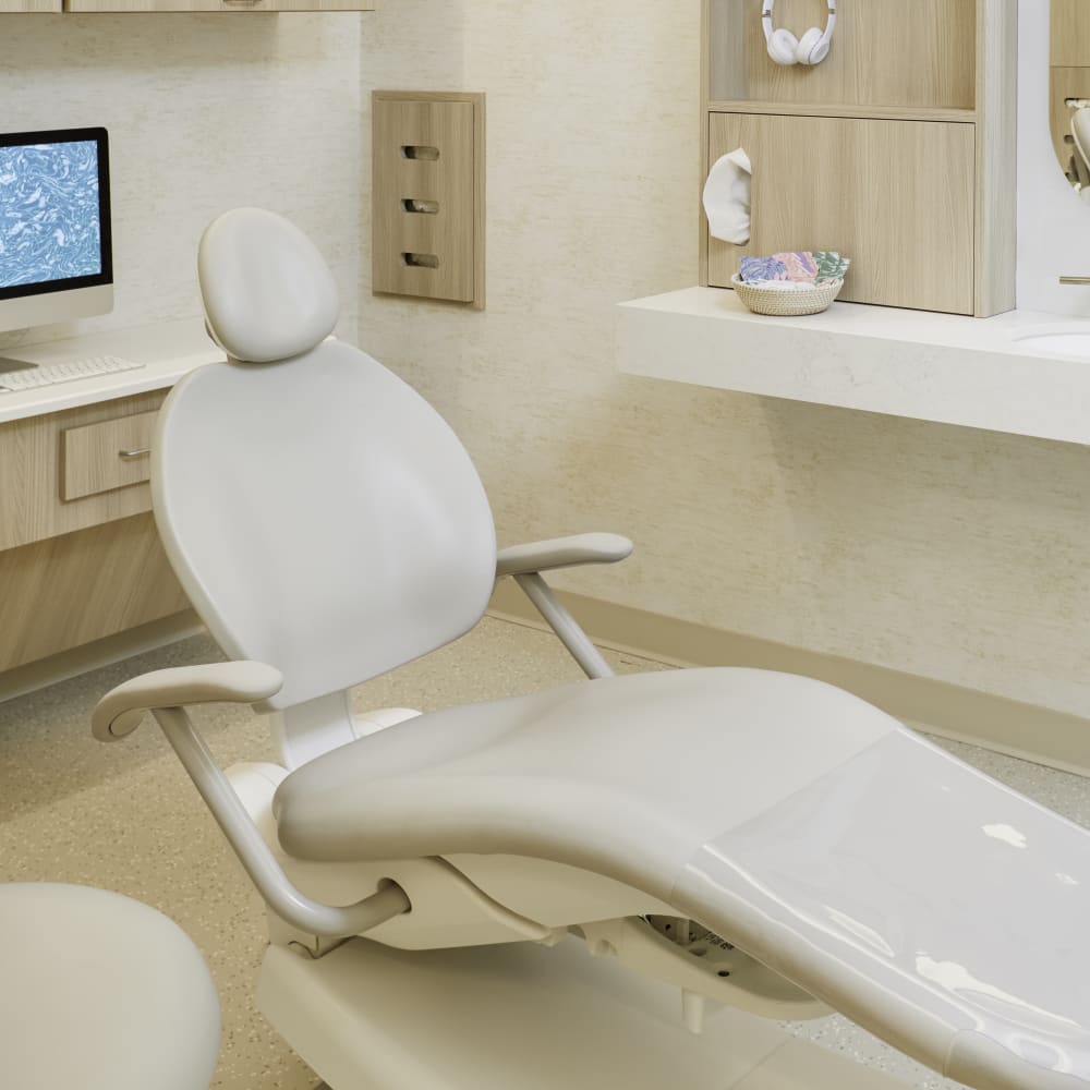 A dental chair in an exam room at Tend