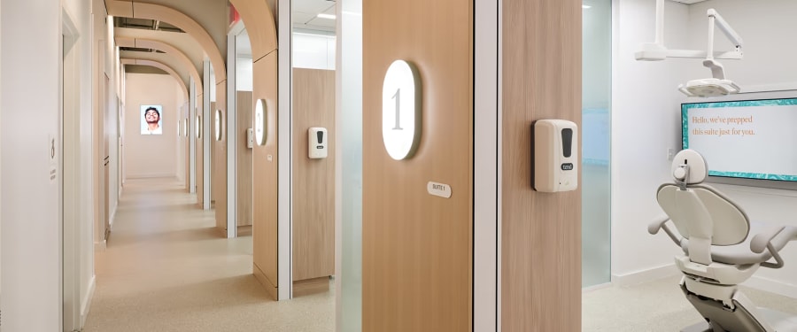 Photo of the sleek, bright hallway leading to the beautifully appointed treatment rooms.