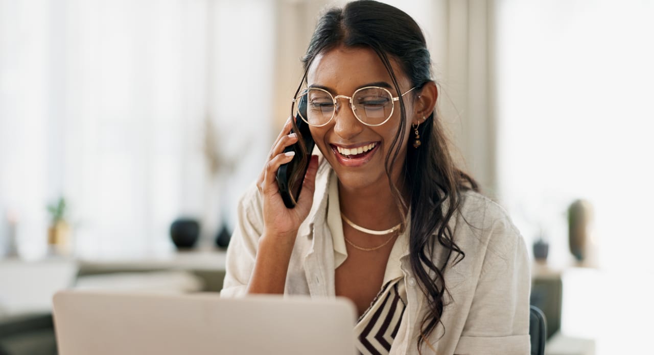 A woman is talking on the phone.