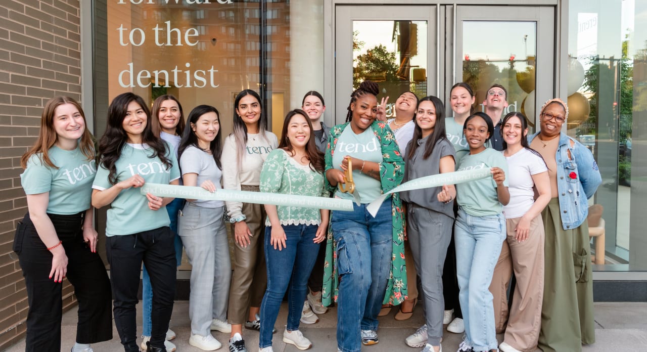 Team members from Tend Dental cut the ribbon at the Pentagon City studio opening.