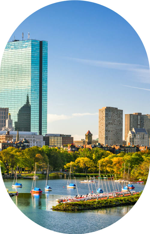 A man sits outside holding his hand to face indicating tooth discomfort.