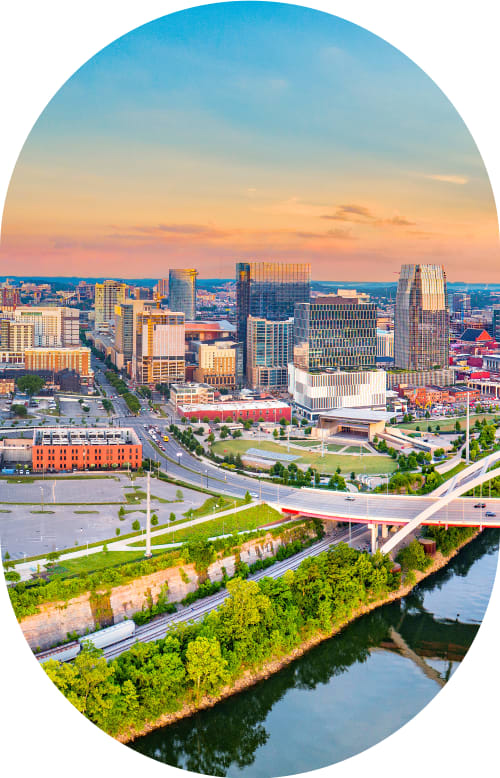 A scenic view of the Nashville skyline at sunset or sunrise. 